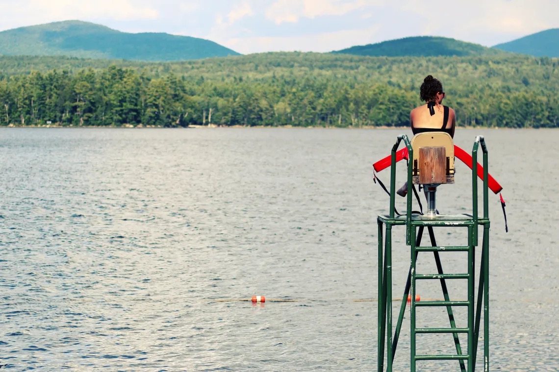 counselor and camper on the dock